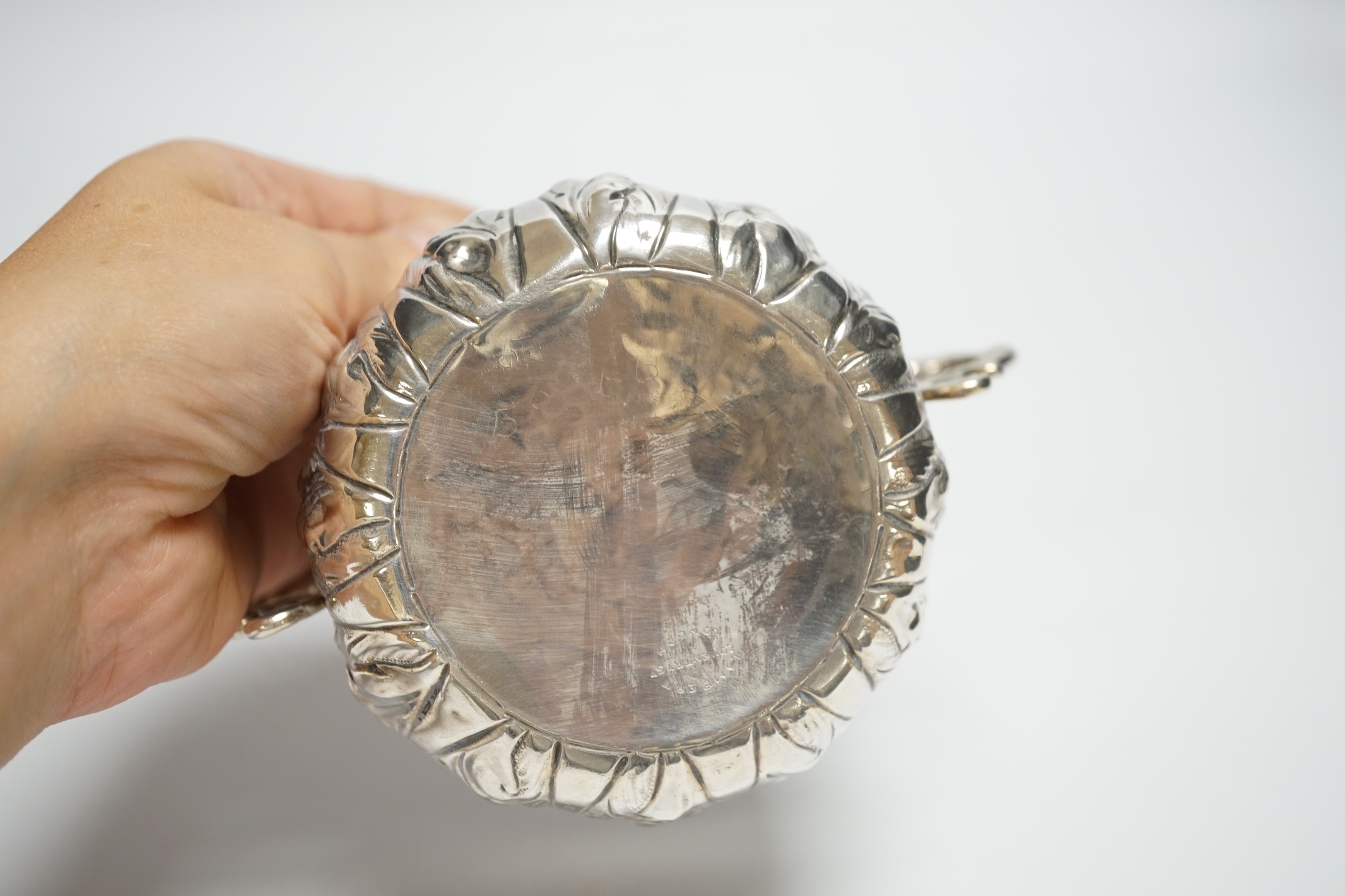 A late Victorian Britannia standard silver porringer with foliate decoration, Lambert & Co, London, 1895, with engraved inscription, 5.7oz.